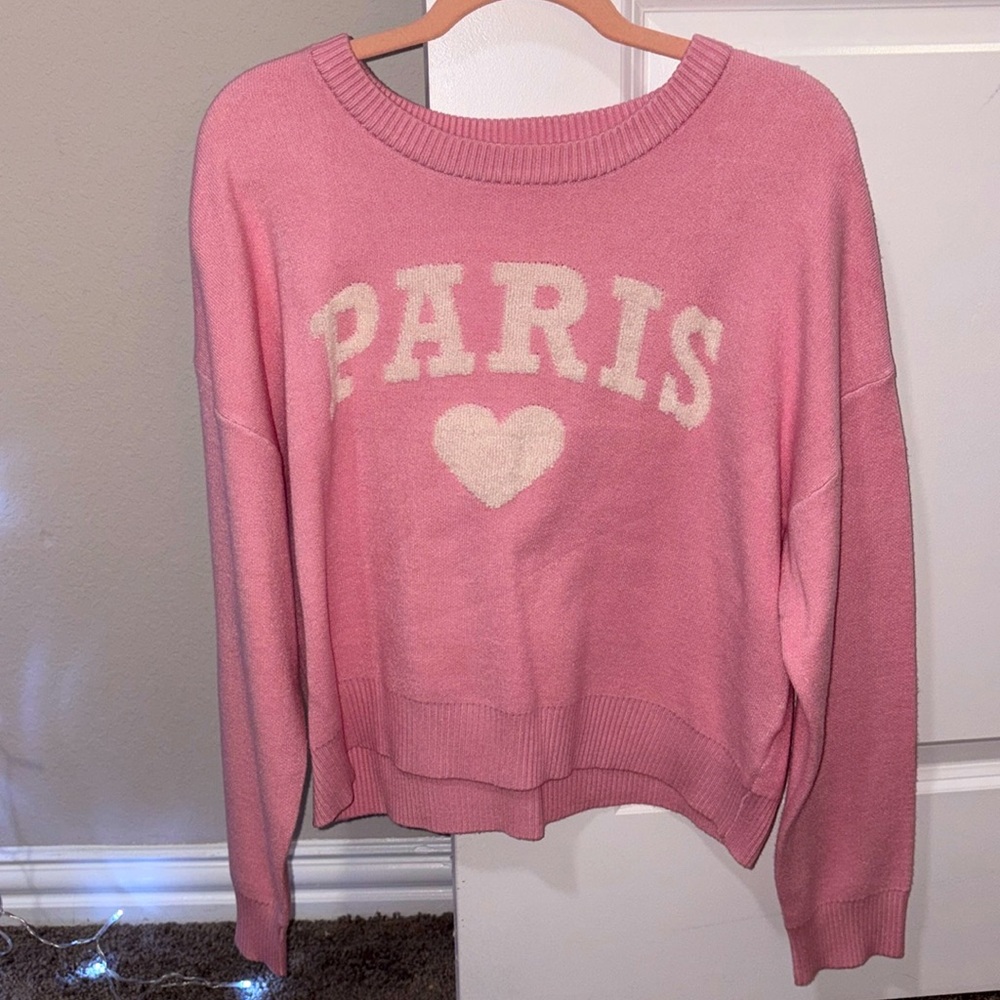 It is a sweater like material! It is soft and comfy. 
The brand is Nikka K.